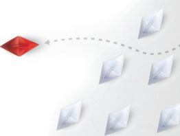 Red paper boat breaking away from white boats