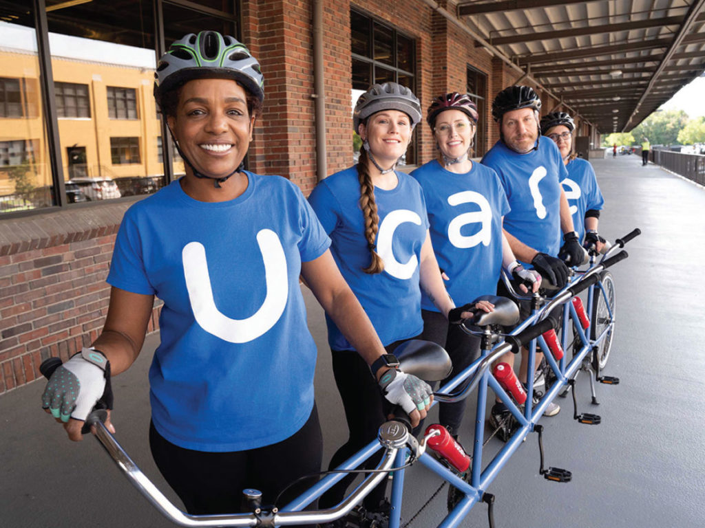 Ucare team on a bicycle built for five 