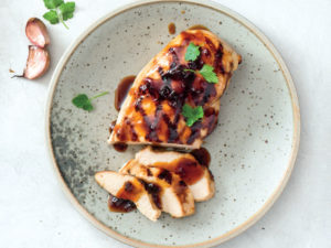 chicken breast with sauce on it