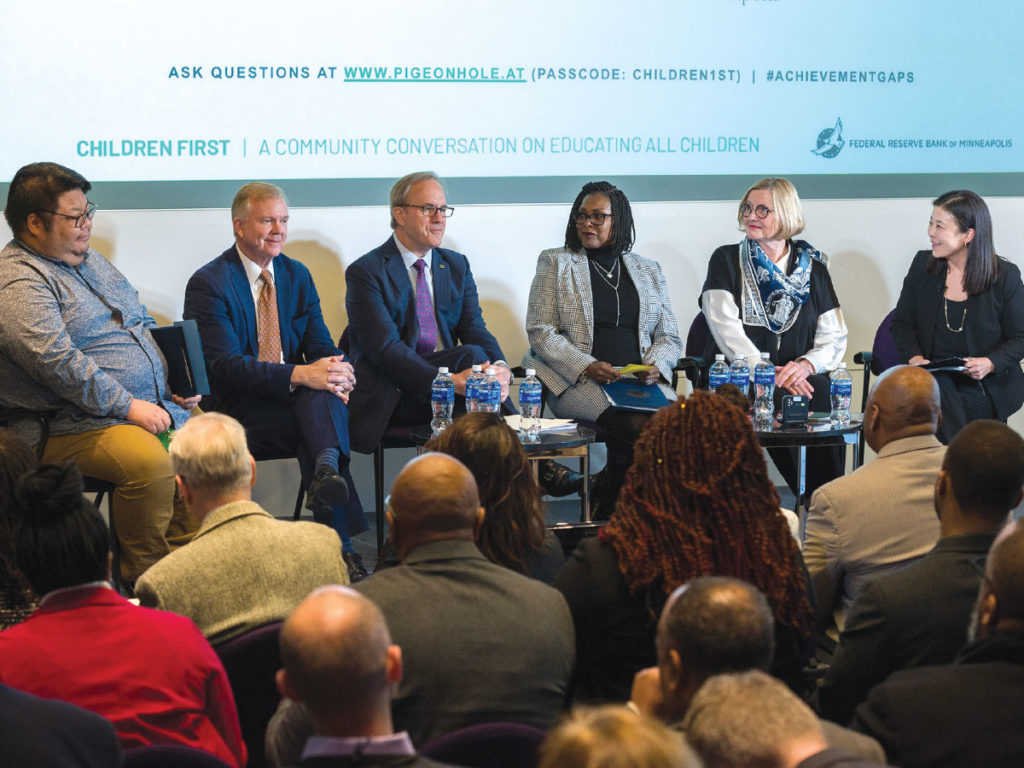 Six panelists in front of group