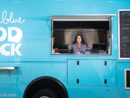 Stephanie Shimp in ordering window of the Blue Plate food truck
