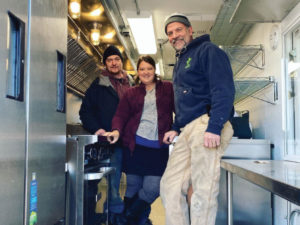 John Hingos, Sara Hingos, and Mark Palm inside Crooked Spoon’s new ride.