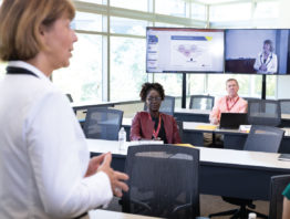 Svjetlana Madzar, a senior lecturer at the Carlson School of Management, teaches using a hyflex classroom. Technology enables her to see students via Zoom and in person at the same time, while students can see and hear each other at all times.