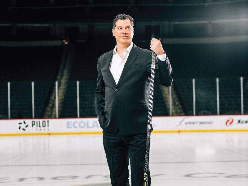 Bill Guerin standing with hockey stick