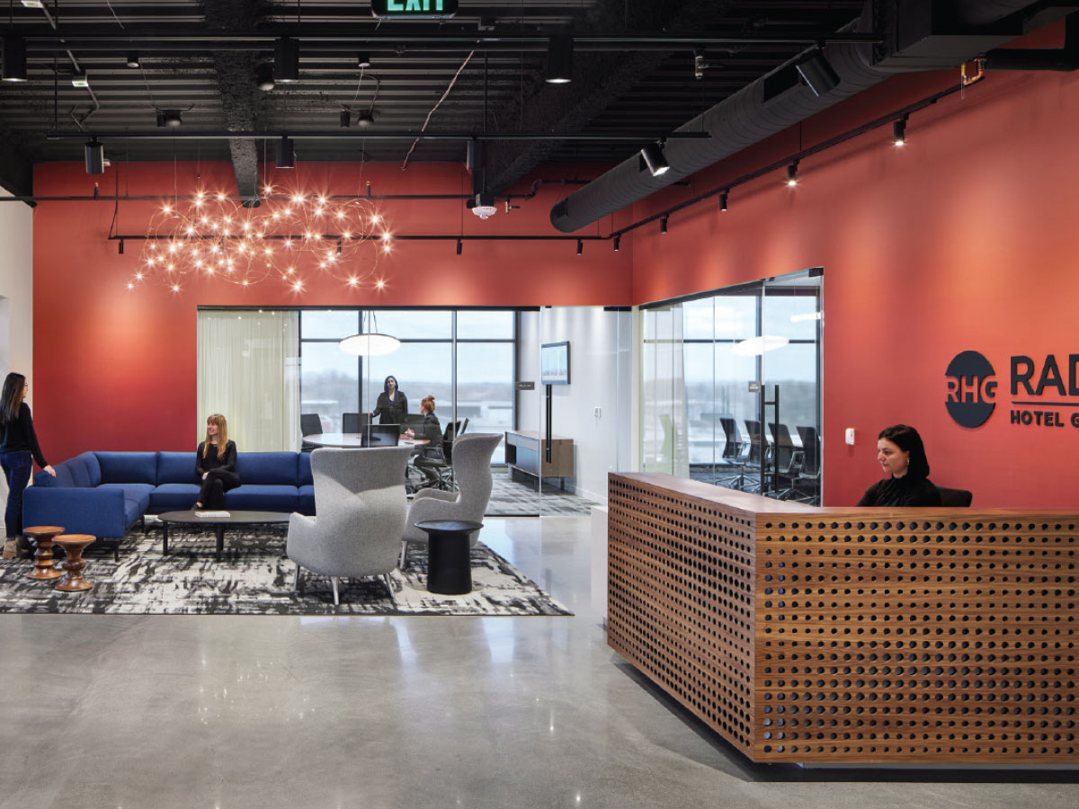 The reception area emulates a hotel lobby while paying homage to the Radisson hotel brands, from Radisson Blu to Country Inn & Suites, with a classic, timeless design.