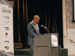 Teddy Bekele accepting a 2022 Outstanding Director award at the Metropolitan Ballroom in Minnesota