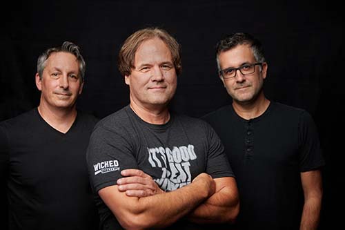 Wicked Kitchen CEO Pete Speranza (center) stands alongside founders Chad and Derek Sarno.