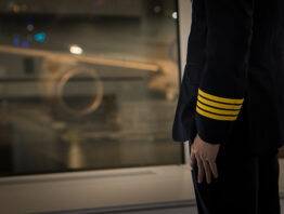 pilot wear four golden strips jacket in airport terminal