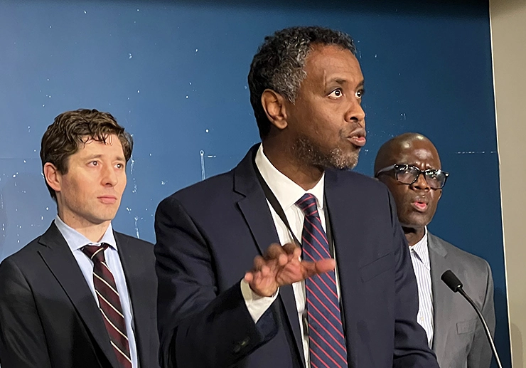 Minneapolis Public Housing Authority executive director and CEO Abdi Warsame, center, speaking as Mayor Jacob Frey, left, and Elfric Porte, the city's director of housing policy and development, look on during a news conference at the Minnesota State Capitol on Friday, March 3.