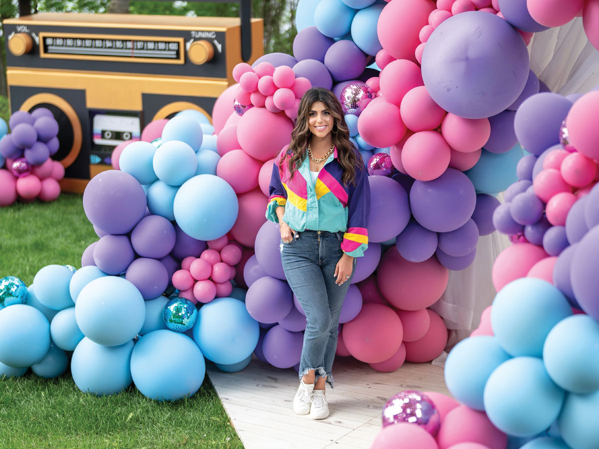woman standing in front of balloons