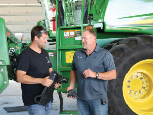 Zach Johnsone and sales manager Eric Bates with the G4 Stalk Stomper