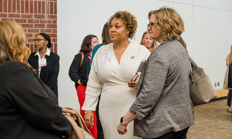 scenes from TCB's 2023 Women in Leadership event at the Saint Paul RiverCentre