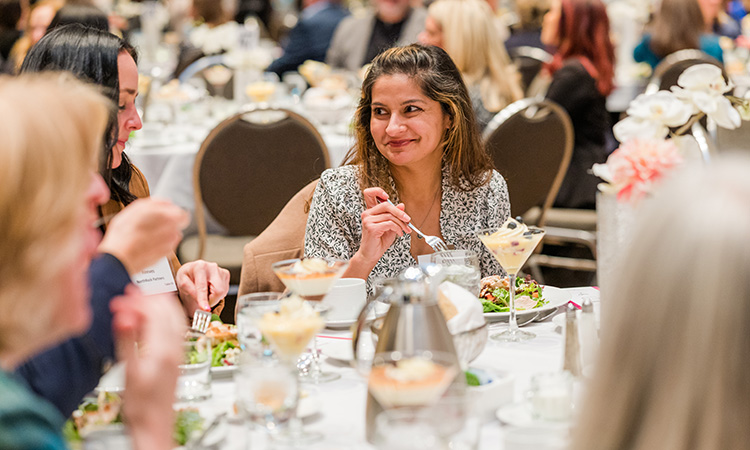 scenes from TCB's 2023 Women in Leadership event at the Saint Paul RiverCentre