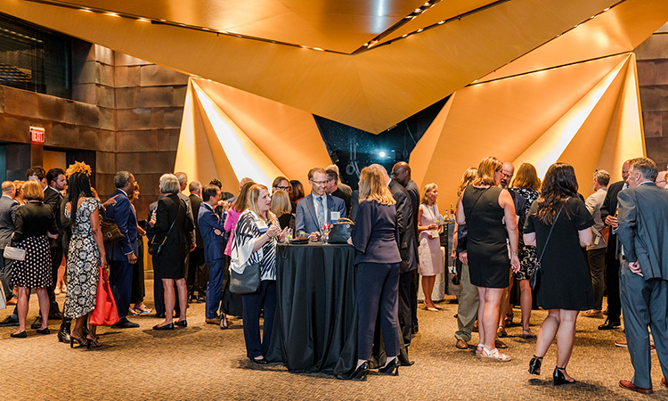 Attendees gather for a cocktail reception at the McNamara Alumni Center