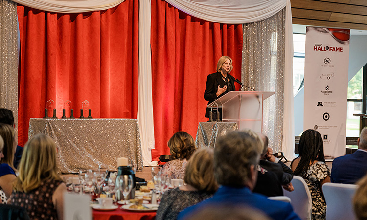 Maurices Senior VP, chief HR & communications officer Sue Ross introduces George Goldfarb.