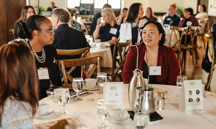 Female attendees sit at a table at TCB Talks: Diversity, Equity, and Inclusion on June 15, 2023