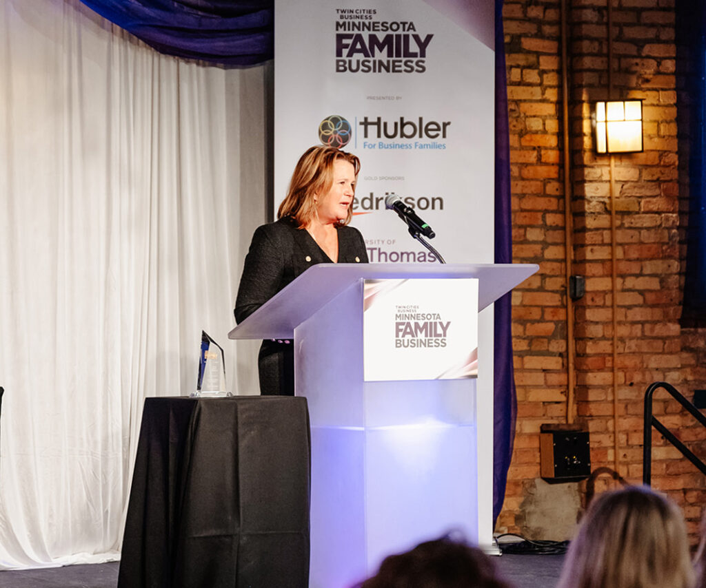 Katie Prokop, CEO of Arrowhead Promotion & Fulfillment, accepts a Minnesota Family Business Award.