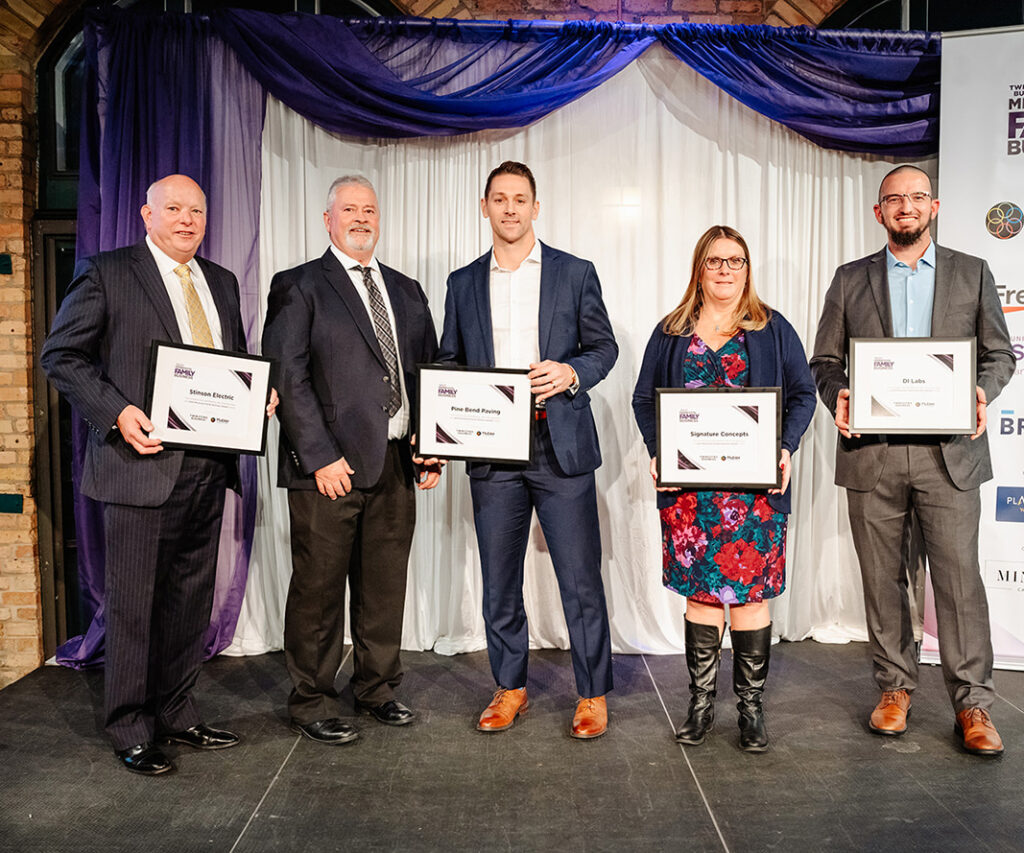 Minnesota Family Business Awards: 2023 Finalists pose for a photo on stage.