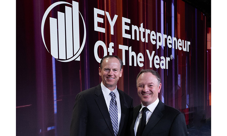 Michael Happe poses for a photo upon receiving a national honor from EY.