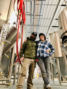 Rob Miller and Sarah Bonvallet stand in their Maple Lake production facility.