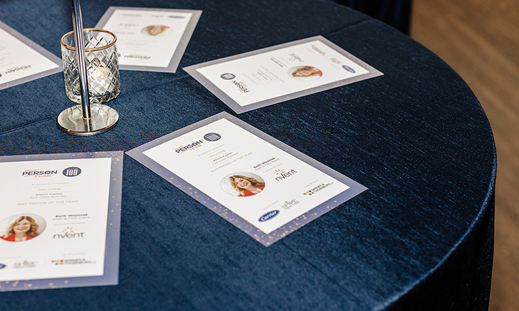 Pamphlets on a table for TCB's Person of the Year ceremony on December 4, 2023