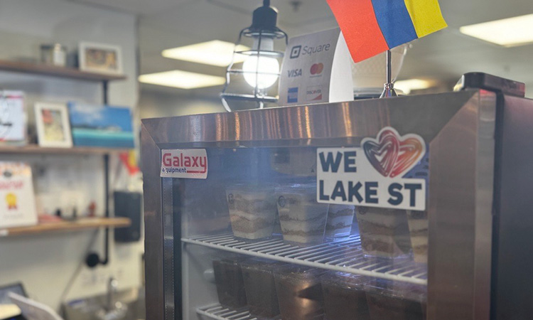 A fridge bearing a "We Love Lake Street" sticker at Midtown Global Market