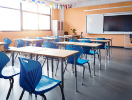 rows of desks in a modern classroom