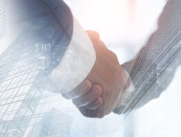 conceptual image of two hands shaking, representing mergers and acquisitions