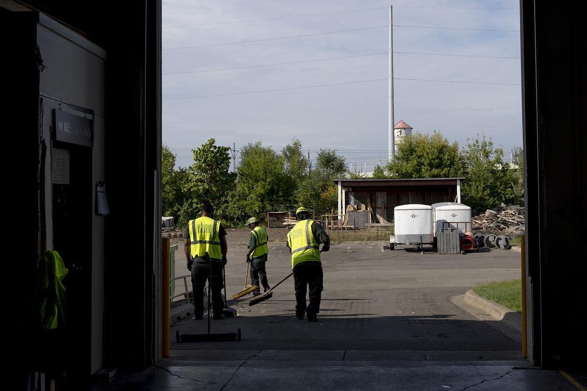 Employees clean up the loading dock at Better Futures on Wednesday, Sept. 17, 2025, in Minneapolis. The nonprofit organization helps formerly incarcerated people gain job experience by offering them no-cost training in the construction and manufacturing industry and transition assistance.