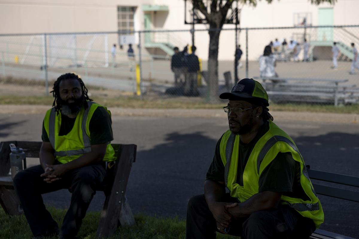 Johntay Neal, left, and Raphael Smith take a break during their shift at Better Futures on Wednesday, Sept. 17, 2025, in Minneapolis, Minn. Neal has been in the program for about a month, while Smith has been working with the nonprofit organization for a year after four years in prison.